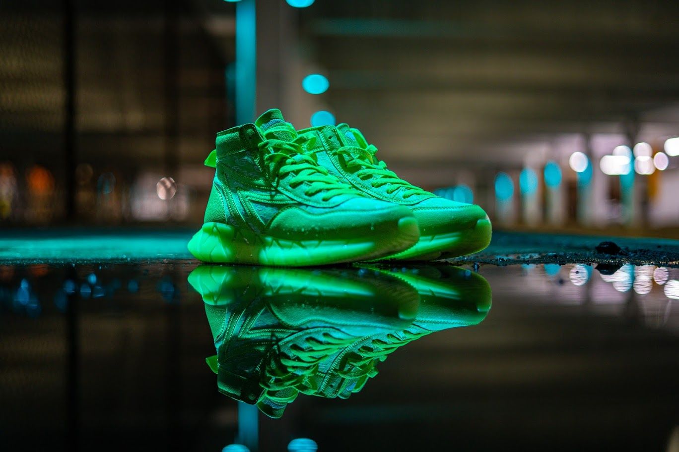 A single neon green sneaker on wet reflective ground at night